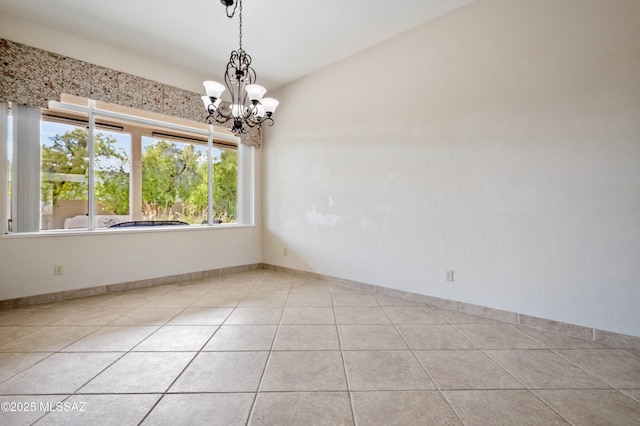 420 E Deers Rest Pl, Tucson, AZ 85704 - tiled spare room with an inviting chandelier and baseboards
