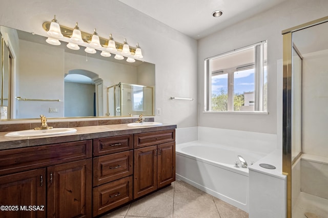 420 E Deers Rest Pl, Tucson, AZ 85704 - bathroom featuring double vanity, a sink, a garden tub, and a shower stall