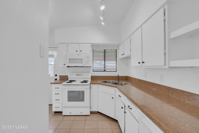 kitchen featuring white cabinetry, light tile patterned floors, a sink, and white appliances