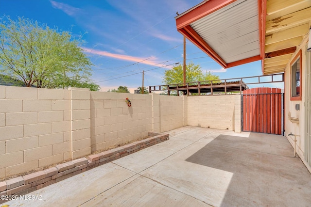 view of patio / terrace featuring a fenced backyard and a gate