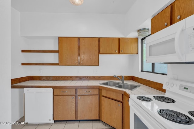 kitchen featuring a sink, tile counters, open shelves, and white appliances