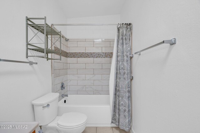 full bathroom featuring tile patterned floors, toilet, and shower / bathtub combination with curtain