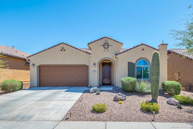 6949 W Tanner Trl, Marana, AZ 85658 - mediterranean / spanish-style home featuring stucco siding, driveway, a tiled roof, and an attached garage