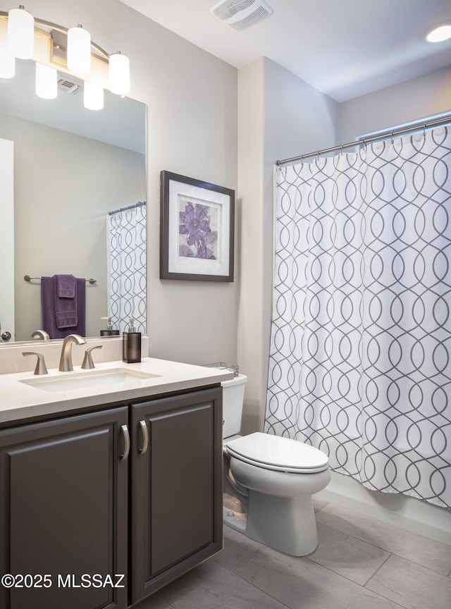 6949 W Tanner Trl, Marana, AZ 85658 - bathroom featuring visible vents, toilet, shower / tub combo, and vanity
