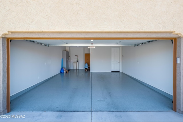 6949 W Tanner Trl, Marana, AZ 85658 - garage featuring water heater and baseboards