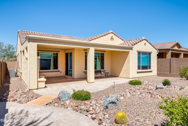 6949 W Tanner Trl, Marana, AZ 85658 - back of property featuring a fenced backyard, central AC, stucco siding, and a patio area