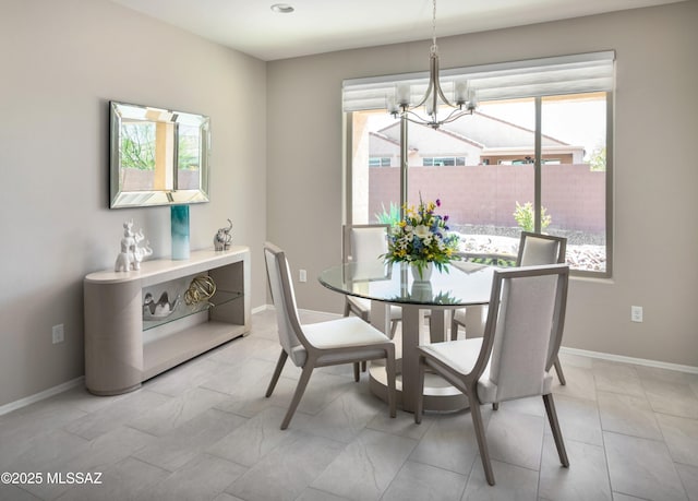 6949 W Tanner Trl, Marana, AZ 85658 - dining room with a notable chandelier and baseboards