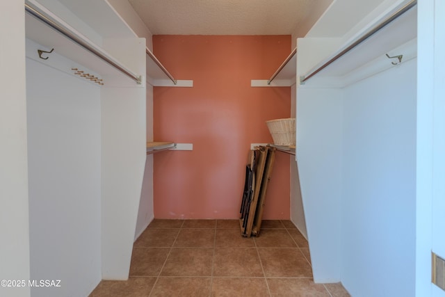 walk in closet featuring light tile patterned floors