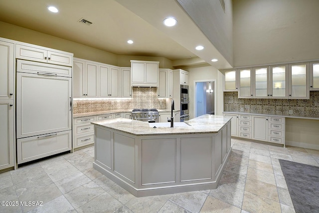 7222 E Desert Moon Loop, Tucson, AZ 85750 - kitchen featuring high quality appliances, a sink, recessed lighting, backsplash, and a large island