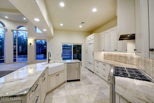 7222 E Desert Moon Loop, Tucson, AZ 85750 - kitchen featuring dishwasher, a sink, paneled built in refrigerator, range, and backsplash