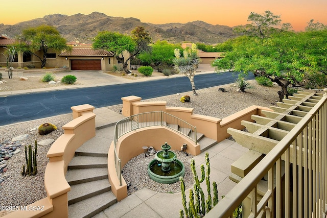7222 E Desert Moon Loop, Tucson, AZ 85750 - pool at dusk with stairs and a mountain view