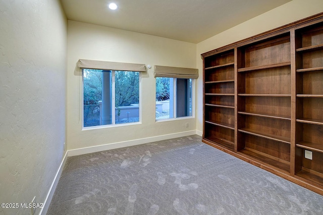 7222 E Desert Moon Loop, Tucson, AZ 85750 - carpeted empty room with baseboards and a textured wall