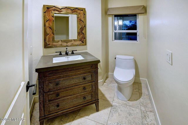 7222 E Desert Moon Loop, Tucson, AZ 85750 - bathroom with vanity, toilet, tile patterned flooring, and baseboards