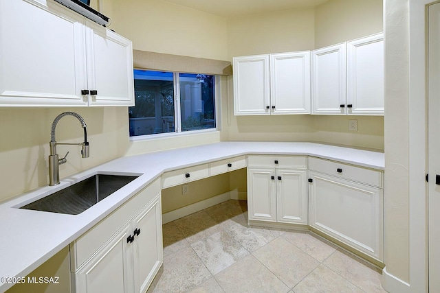 7222 E Desert Moon Loop, Tucson, AZ 85750 - kitchen featuring a sink, white cabinets, light countertops, and light tile patterned floors