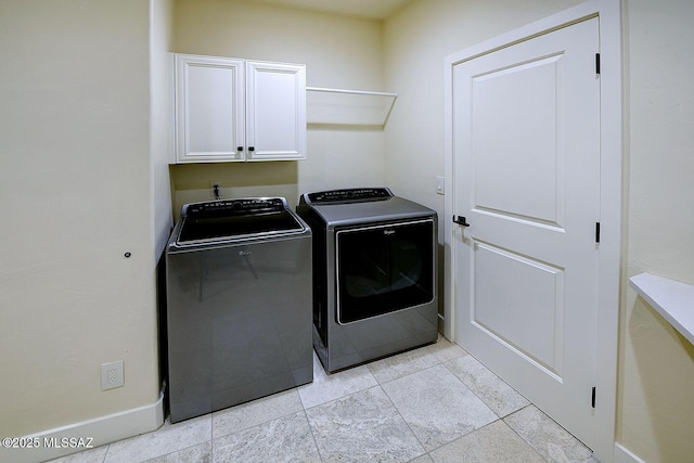 7222 E Desert Moon Loop, Tucson, AZ 85750 - laundry area featuring cabinet space, independent washer and dryer, baseboards, and light tile patterned floors
