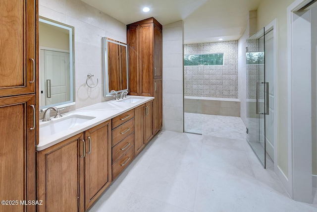 7222 E Desert Moon Loop, Tucson, AZ 85750 - bathroom featuring a tile shower, double vanity, tile patterned floors, and recessed lighting