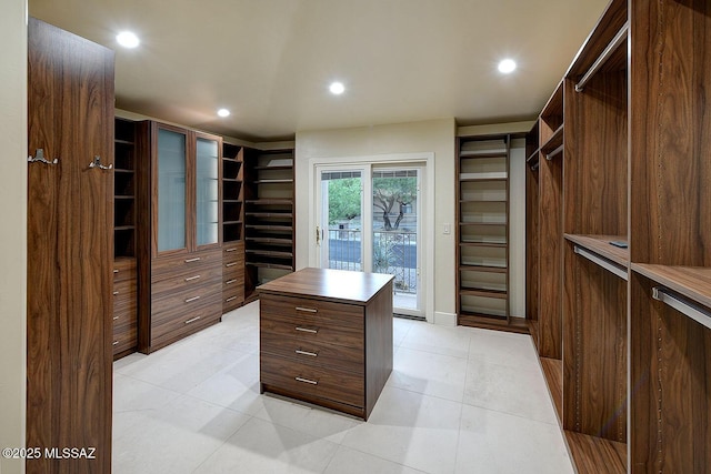 7222 E Desert Moon Loop, Tucson, AZ 85750 - walk in closet featuring light tile patterned flooring