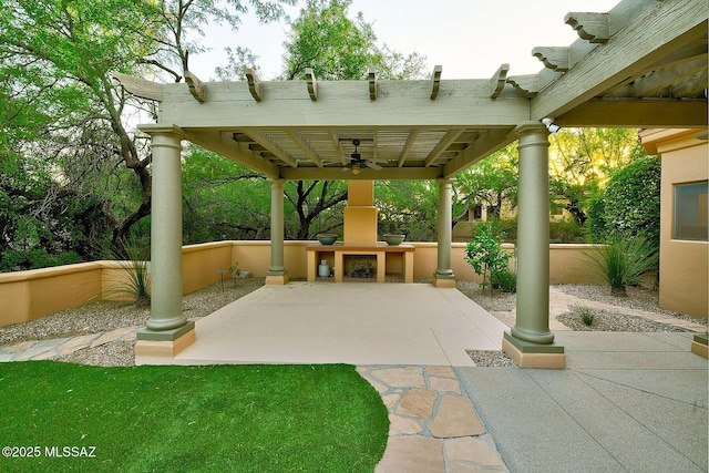 7222 E Desert Moon Loop, Tucson, AZ 85750 - view of patio / terrace with an outdoor fireplace, ceiling fan, and a pergola