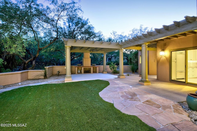 7222 E Desert Moon Loop, Tucson, AZ 85750 - view of grassy yard with a fireplace, a patio area, and a pergola