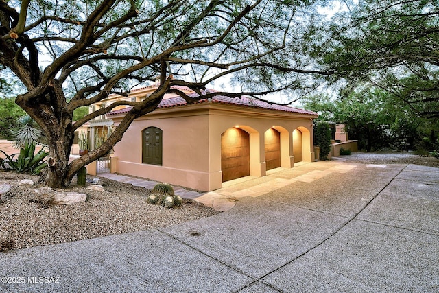 7222 E Desert Moon Loop, Tucson, AZ 85750 - view of home's exterior with stucco siding and a tiled roof