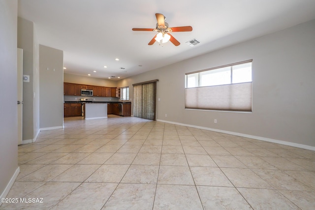 unfurnished living room featuring baseboards, a ceiling fan, visible vents, and recessed lighting