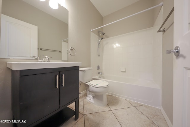 full bathroom featuring toilet, vanity, baseboards, tile patterned flooring, and bathing tub / shower combination