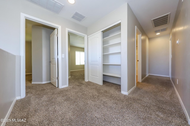 interior space featuring carpet floors and visible vents