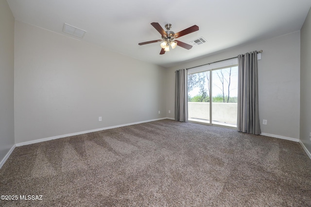 carpeted empty room with baseboards, a ceiling fan, and visible vents