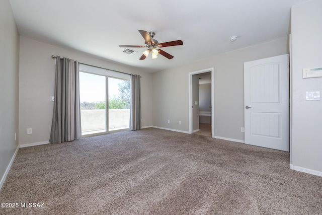 carpeted empty room featuring visible vents, baseboards, and ceiling fan