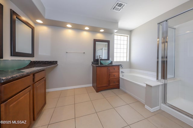 full bathroom featuring tile patterned floors, a sink, a stall shower, visible vents, and recessed lighting