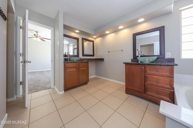 full bathroom with two vanities, a sink, recessed lighting, and tile patterned flooring