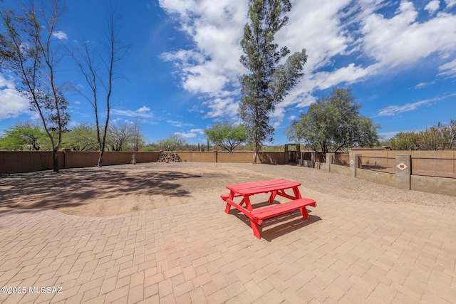 surrounding community featuring a patio area and fence