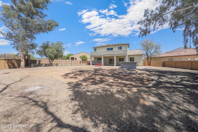 back of property featuring a patio area, a fenced backyard, and stucco siding