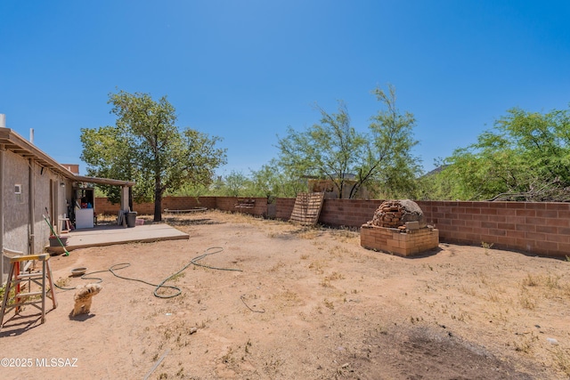 view of yard with a fenced backyard and a patio