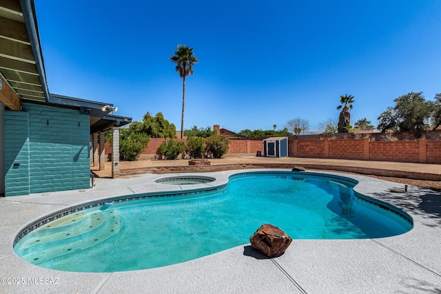 view of swimming pool with a fenced backyard, an in ground hot tub, a patio area, and a fenced in pool