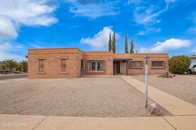 view of front of house with brick siding
