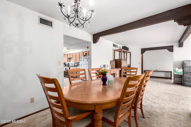 dining room with visible vents, baseboards, beam ceiling, light carpet, and an inviting chandelier