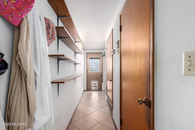hallway with light tile patterned floors