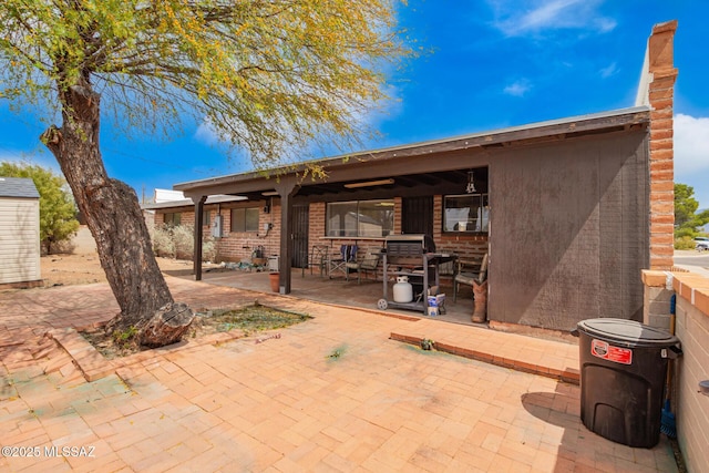 rear view of house featuring a patio area