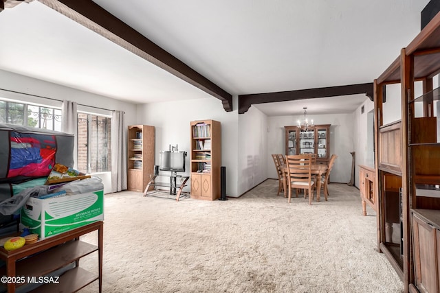 interior space featuring carpet flooring, a chandelier, and beam ceiling