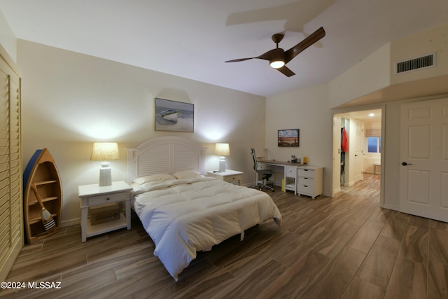 875 S Corte Monte Cristo, Green Valley, AZ 85614 - bedroom featuring visible vents, baseboards, a ceiling fan, wood finished floors, and lofted ceiling