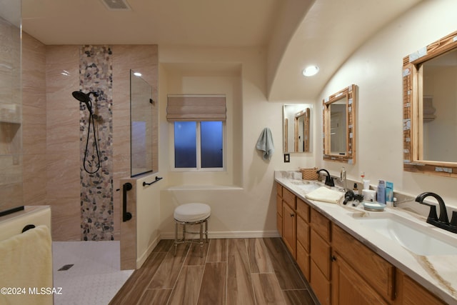875 S Corte Monte Cristo, Green Valley, AZ 85614 - full bath with walk in shower, double vanity, a sink, and wood finish floors