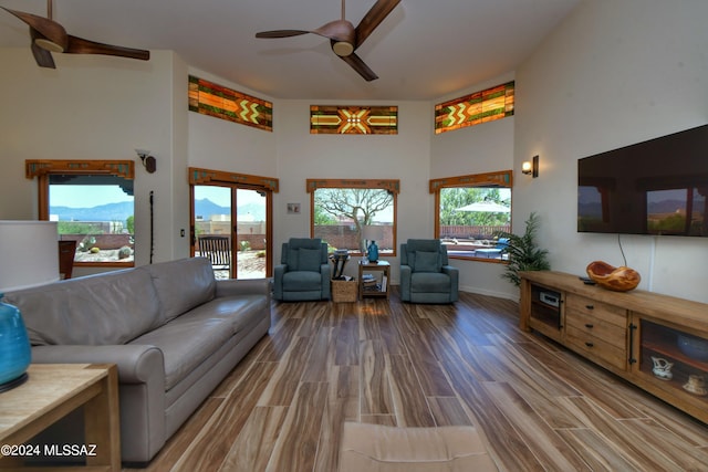 875 S Corte Monte Cristo, Green Valley, AZ 85614 - living room with a wealth of natural light, a towering ceiling, wood finished floors, and ceiling fan