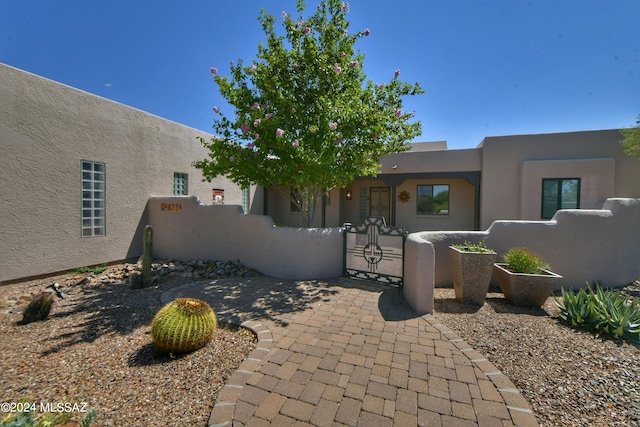 875 S Corte Monte Cristo, Green Valley, AZ 85614 - view of front of home with stucco siding and a fenced front yard