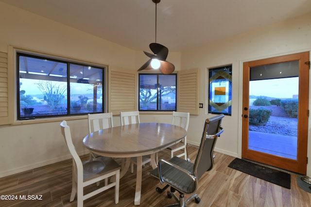 875 S Corte Monte Cristo, Green Valley, AZ 85614 - dining area featuring plenty of natural light, baseboards, and wood finished floors