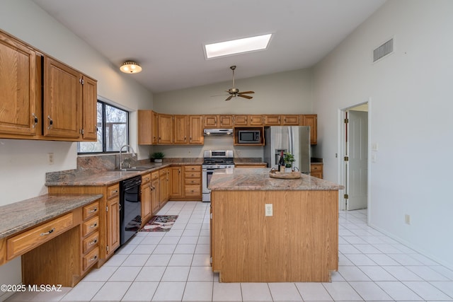 kitchen featuring visible vents, a center island, a sink, appliances with stainless steel finishes, and under cabinet range hood