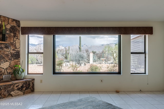 interior space featuring tile patterned flooring and a mountain view