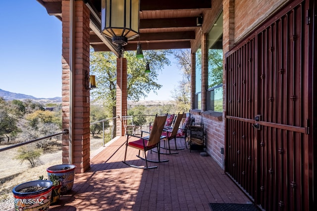 view of patio / terrace featuring a mountain view