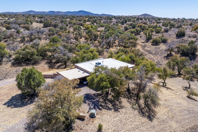 birds eye view of property with a mountain view