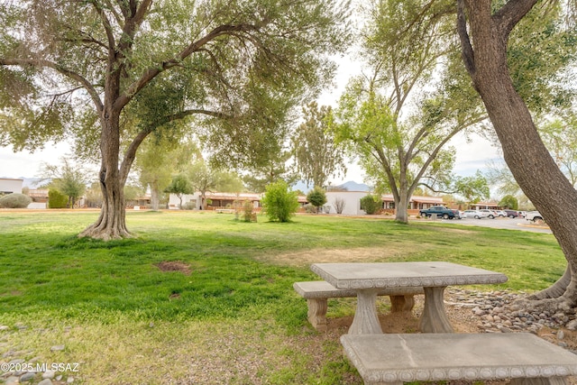 surrounding community featuring a lawn